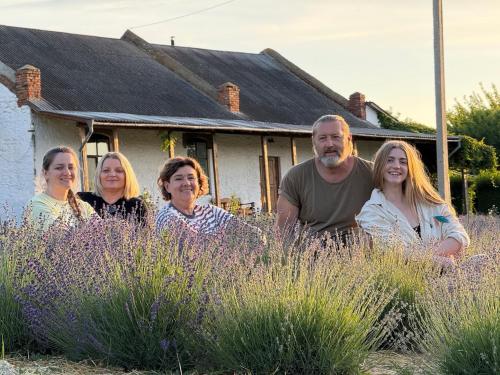 a group of people standing in front of a house at Hotel Rafinad in Sharhorod