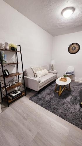 a living room with a couch and a table at New Renovated USA Side in Niagara Falls