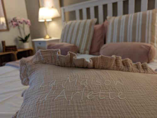 a bed with a blanket and a chair in a room at La Maison d'Arlette - Maison d'Hôte et Gite au coeur de l'Isère à 10 mn de Voiron, capitale de la Chartreuse, et du Lac de Paladru in Saint-Blaise-du-Buis