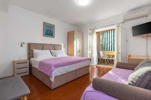 Postel nebo postele na pokoji v ubytování Rooms Ivka