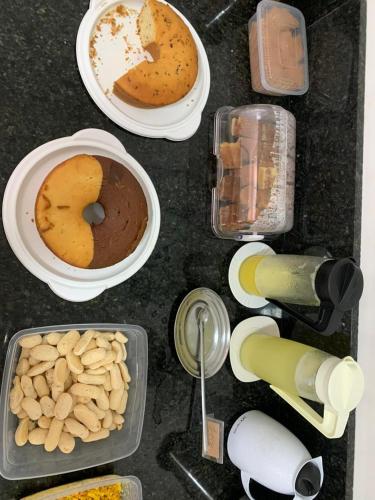 a table topped with different types of food at Pousada Salomão in Teixeira de Freitas