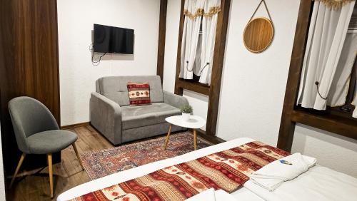 Una televisión o centro de entretenimiento en Apartments HAN Alifakovac-Sarajevo