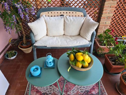 a table with a bowl of fruit on a patio at Casa Anna Maria in Monterosso al Mare