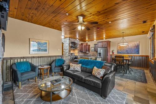 a living room with a couch and a table at TimberCrest Downtown Lakeview Condo South by Casago McCall - Donerightmanagement in McCall