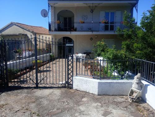 an iron gate in front of a house at Yasmir Home in Grumento Nova