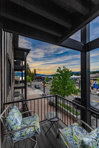 a balcony with two chairs and a view of a street at TimberCrest Downtown Lakeview Condo South by Casago McCall - Donerightmanagement in McCall