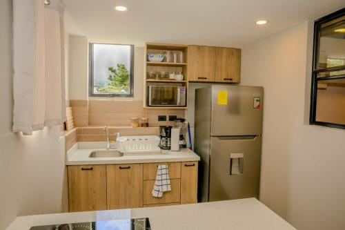 Kuchyň nebo kuchyňský kout v ubytování Apartamento con encanto y diseño