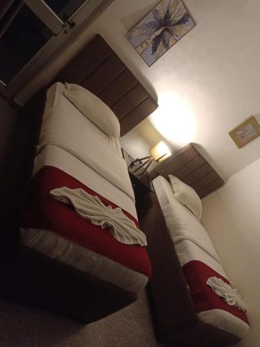 a pair of beds in a room at Tamrah Suites Hotel in Amman