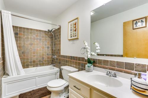 a bathroom with a sink and a toilet and a bath tub at Play, Swim and Unwind Family Home in Glen Wild! in Glen Wild