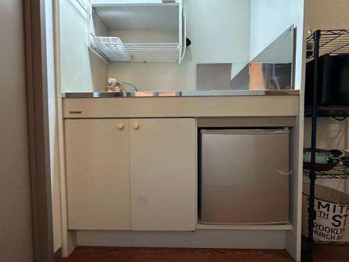 a kitchen with a sink and a dishwasher at Hare no hi Hakushima - Vacation STAY 94989v in Hiroshima