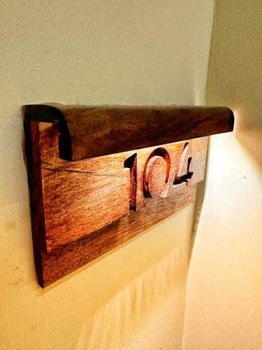 a woodenswitch on a wall with the number on it at Cruiser Mogador Essaouira in Essaouira