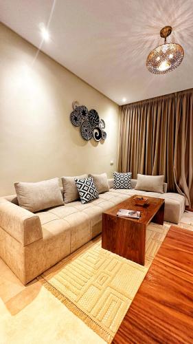 a living room with a couch and a coffee table at Cruiser Mogador Essaouira in Essaouira