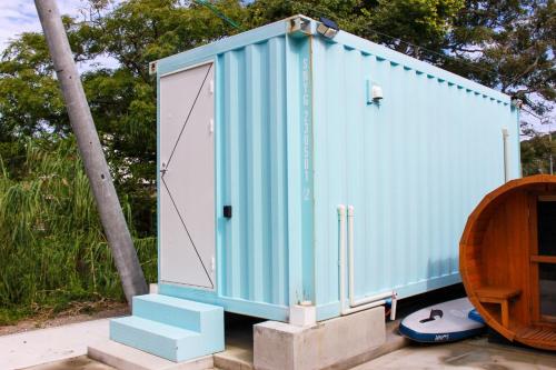 a blue container with a door and some stairs at Villa Mikuri Tsunoshima - Vacation STAY 02209v in Shimonoseki