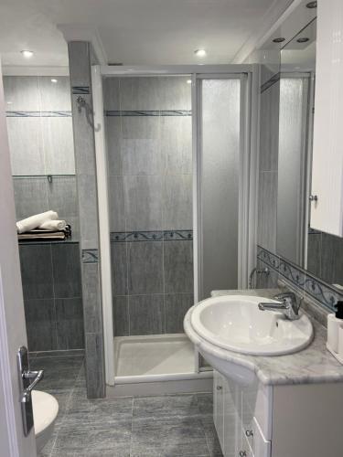 a bathroom with a tub and a sink and a shower at Sol Y Mar in Puerto del Carmen