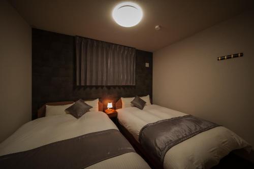 En eller flere senge i et værelse på Mountain Green A "Yuzuki" - Vacation STAY 08283v