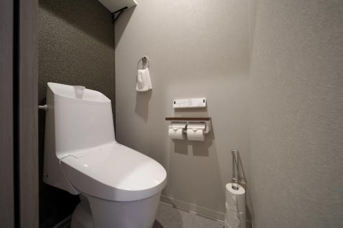 a bathroom with a white toilet in a room at Mountain Green D "Japanese Heart" - Vacation STAY 08400v in Yufuin