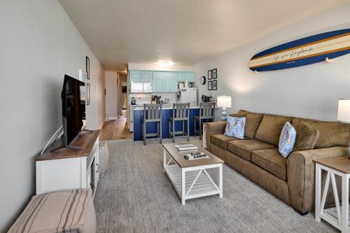 a living room with a couch and a table at Oceanfront Suite - Upper Floor in Lincoln City