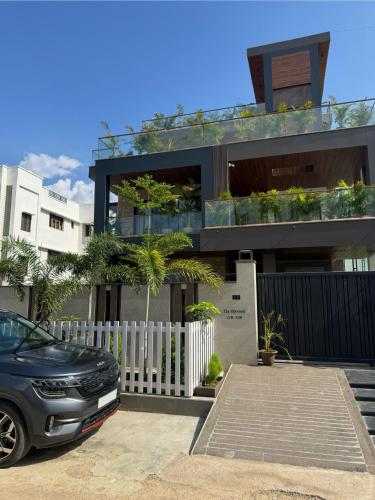 a black car parked in front of a house at Skywood Villa Rooms in Lucknow
