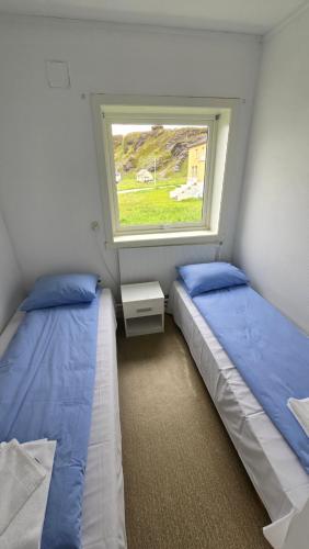 Ένα ή περισσότερα κρεβάτια σε δωμάτιο στο 5-Bedroom Sea View Apartment