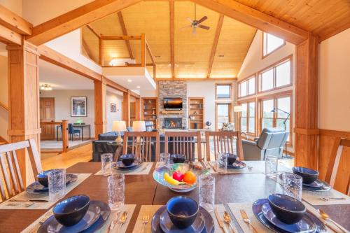 a dining room and living room with a table at Kodak Moments By Avada Properties in Kodak