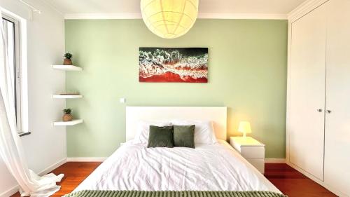 a bedroom with a bed and a painting on the wall at Edna 2 in Funchal