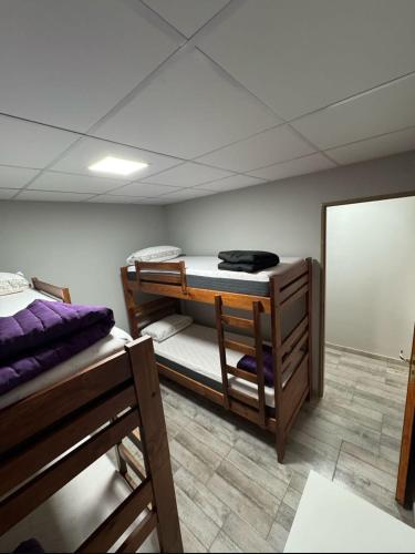 a room with two bunk beds and a mirror at CTA DIVISION House in Malargüe