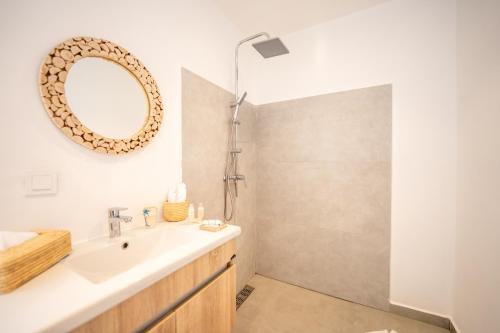 a bathroom with a sink and a shower at Ocean By La Siredrah in Wassane