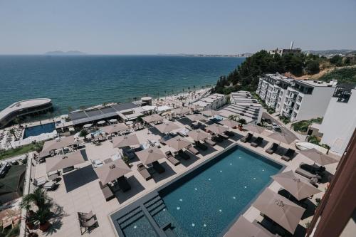 an aerial view of a resort with a pool and beach at Magnus Hotel in Vlorë