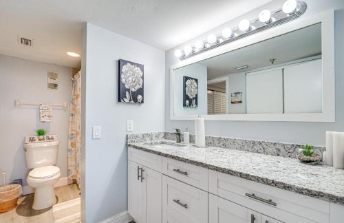 a bathroom with a sink and a toilet and a mirror at Gulf-View Condo in Hudson Perfect for Snowbirds! in Hudson
