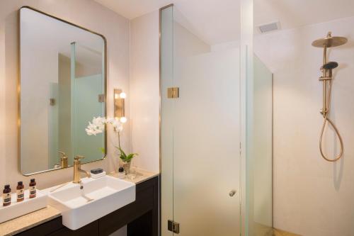 a bathroom with a sink and a shower at The William Inglis Mgallery in Warwick Farm
