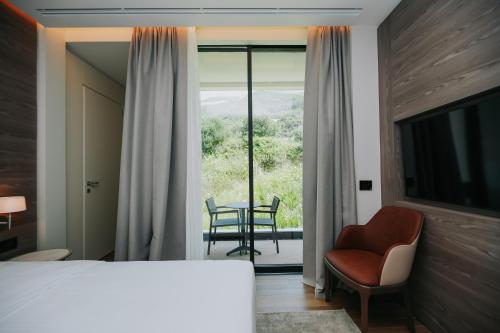 Postel nebo postele na pokoji v ubytování Magnus Hotel