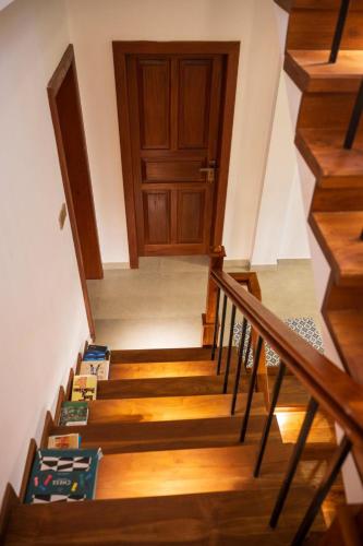 a stairway with a wooden door and a stair case at Hanthana Heritage in Kandy