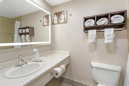a bathroom with a sink and a toilet and a mirror at Best Western Redondo Beach Galleria Inn Hotel - Beach City LA in Redondo Beach