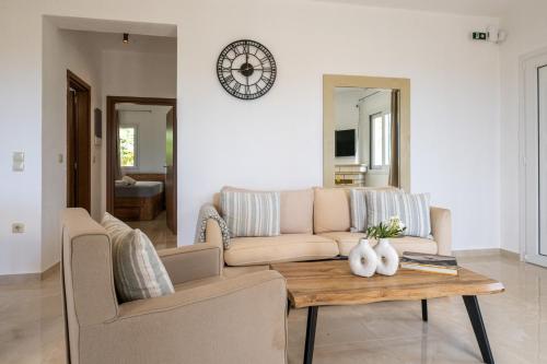 a living room with a couch and a table at Anima Horizon - Elia Villa 