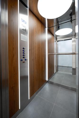 a hallway with a elevator in a building at Zafiro Apartment 21-29 in Kolašin