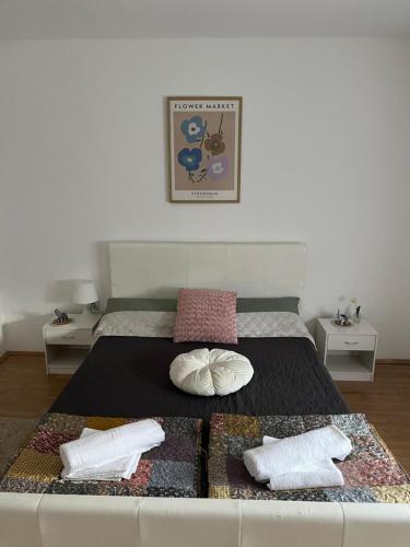 a bedroom with a large bed with two pillows at Elephant House-Sd 