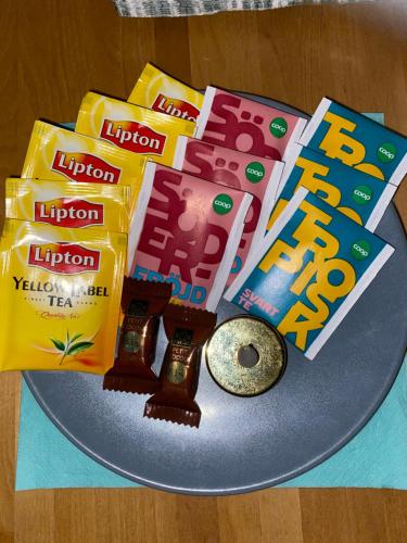 a plate with a bunch of legos and some snacks at DR ÅSA Apartment Penthouse w Pool by the Forest near a Golf course, Concerts and the Baltic Sea in Järna