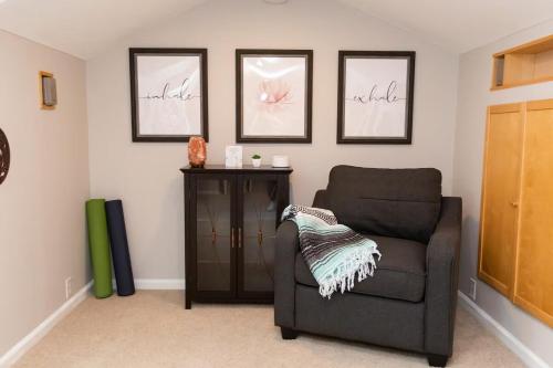 a living room with a chair and a cabinet at Feel At Home In MV - 'Good Vibes Only' Mentality in Mission Viejo