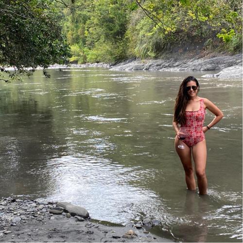 a woman standing in the water in a river at Kasaurora in Tobia