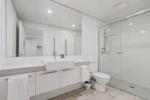 a bathroom with a sink and a toilet and a shower at Moritz 1 in Mount Hotham