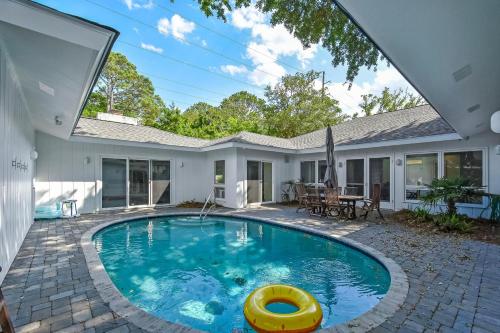a swimming pool in the backyard of a house at 4310 Ninth Street in Saint Simons Island