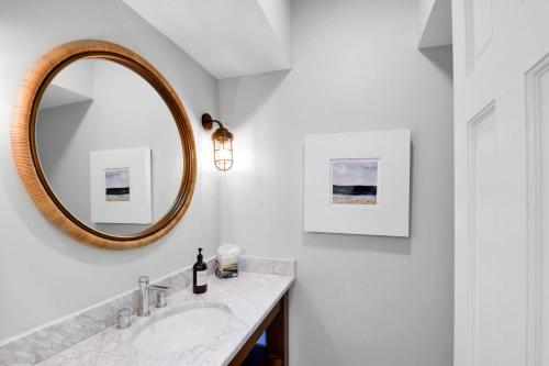 a bathroom with a sink and a mirror at 4310 Ninth Street in Saint Simons Island