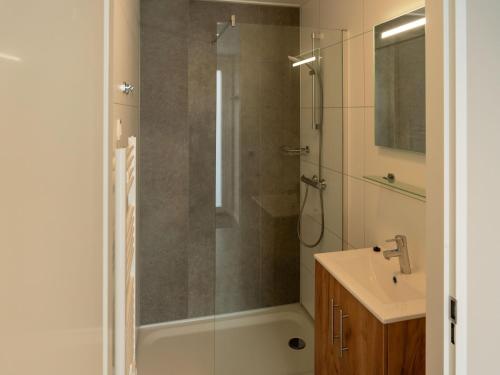 a bathroom with a shower and a sink at Luxury holiday home surrounded by water in Sint Nicolaasga