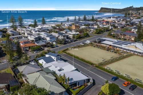 an aerial view of a city with houses and the ocean at Waves - Lennox Head in Lennox Head