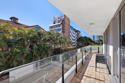 a balcony with a view of a building at ULTIQA Beach Haven on Broadbeach in Gold Coast
