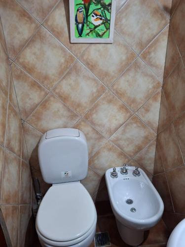 a bathroom with a toilet and a sink at Un espacio en la naturaleza in Salta