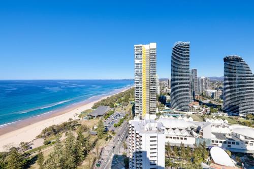 an aerial view of a beach and buildings at ULTIQA Beach Haven on Broadbeach in Gold Coast