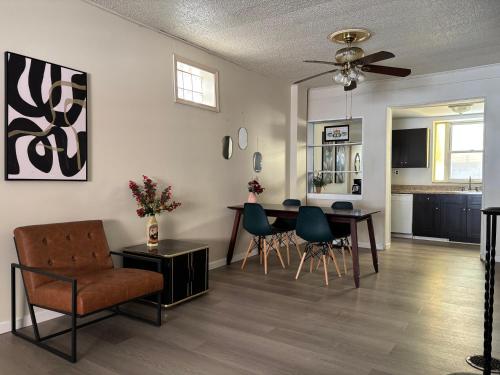 a living room with a dining room table and chairs at Cozy Corner Home Stay in Philadelphia