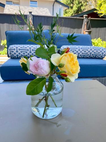 a vase filled with flowers sitting on a table at Richmond home sweet home in Richmond