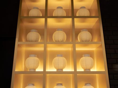 a display of white lights in a shelf at CROSS Life Hakata Tenjin in Fukuoka